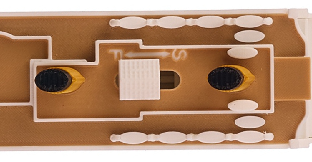 Close-up of the thumb switch on the top deck of the Titanic model