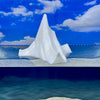 BigBerg jumbo glow-in-the-dark iceberg floating in water against a blue sky