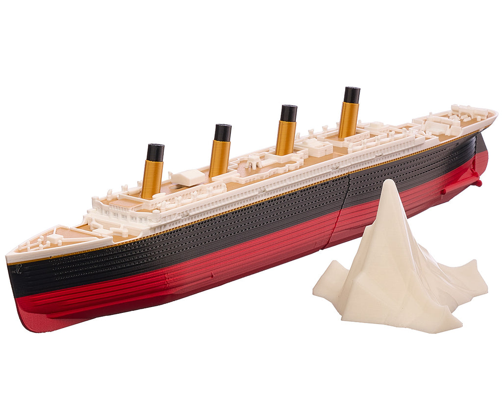 Submersible Titanic model ship with its glow-in-the-dark iceberg alongside